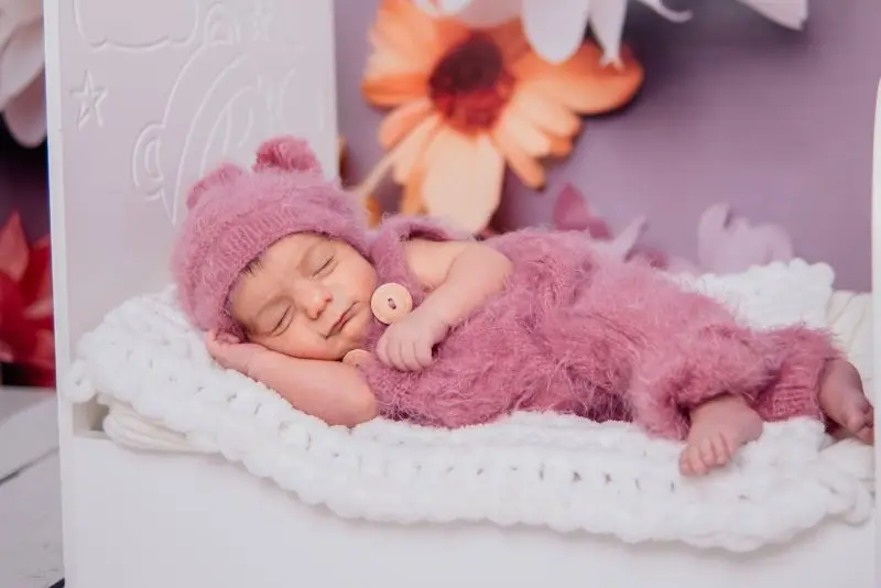 Peaceful baby sleeping after feeding